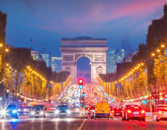 Famous,Champs-elysees,And,Arc,De,Triomphe,At,Twilight,In,Paris,